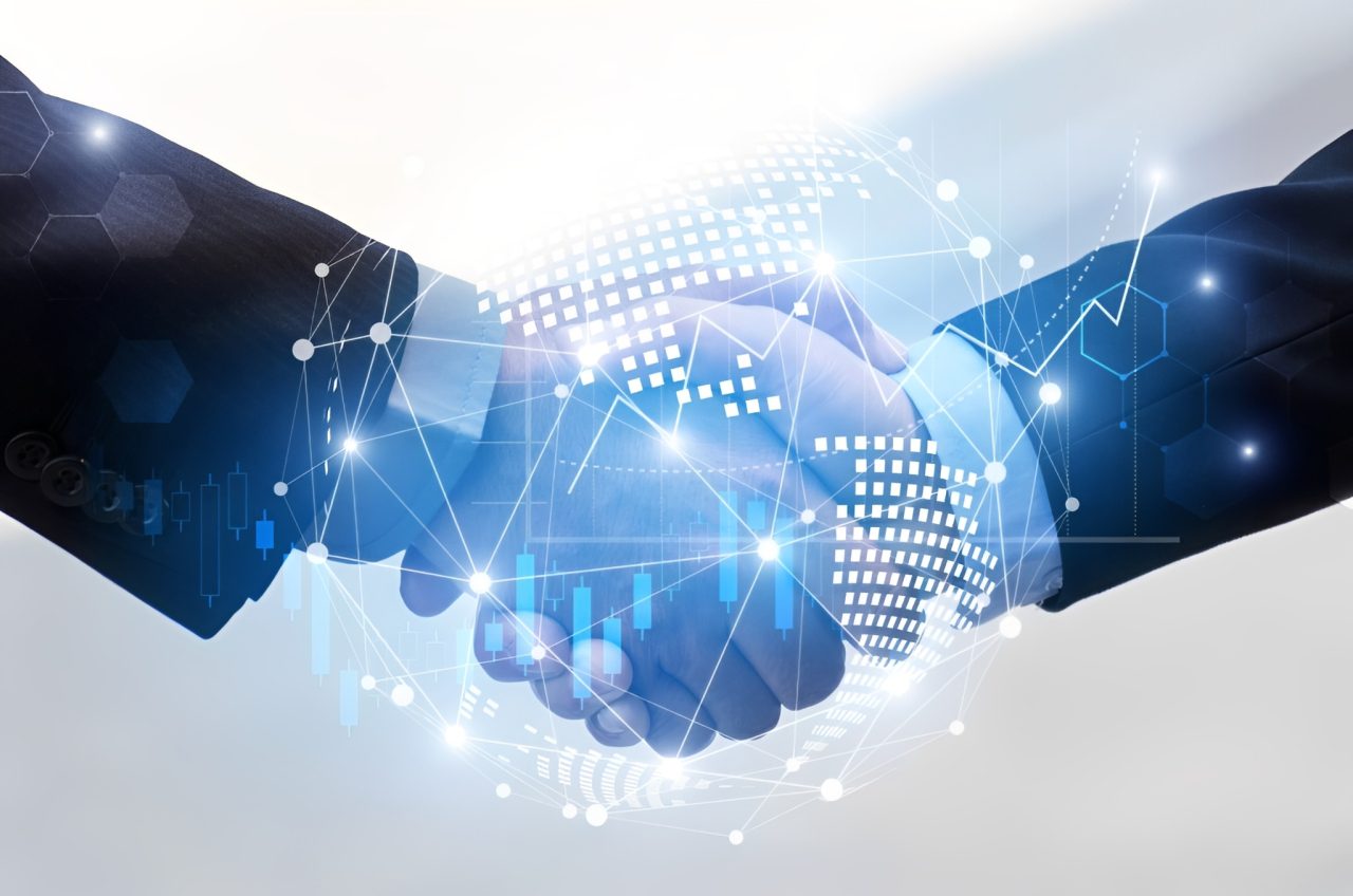 Digital handshake with futuristic technology overlay.